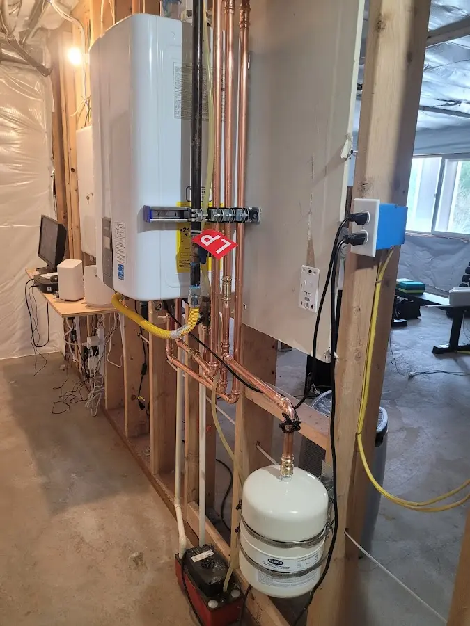 Licensed plumber repairing a kitchen sink in Taylor